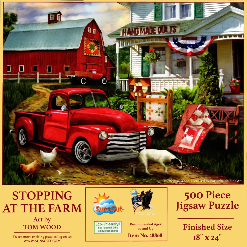 A red vintage pickup truck parked in front of a white farmhouse and a red barn on a sunny day.