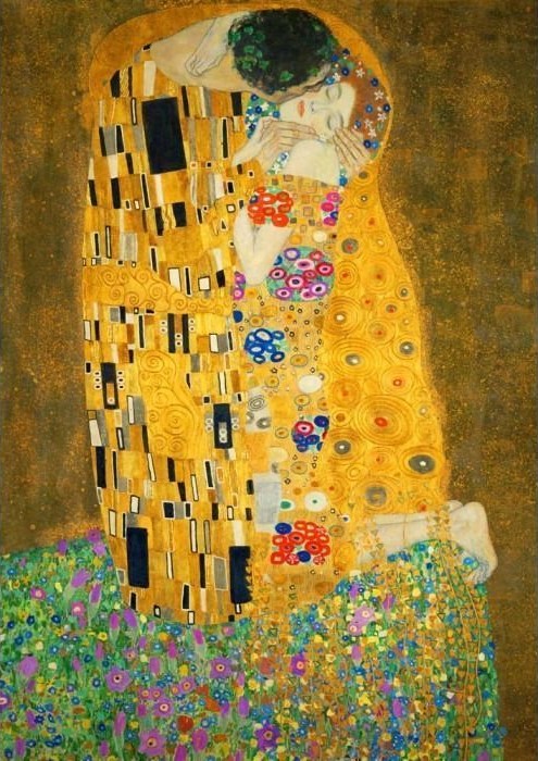 A couple locked in an intimate, golden embrace amidst a field of wildflowers