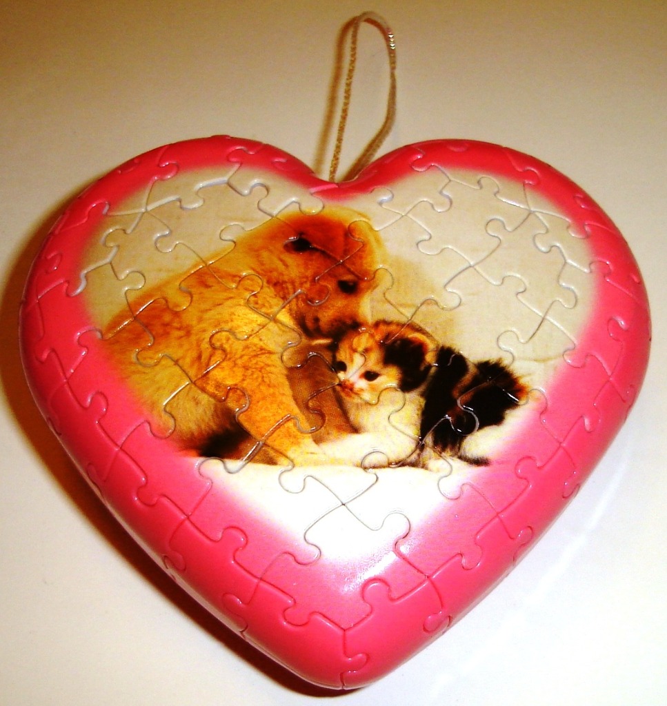 Heart-shaped ornament featuring a golden retriever puppy and a calico kitten sitting together.