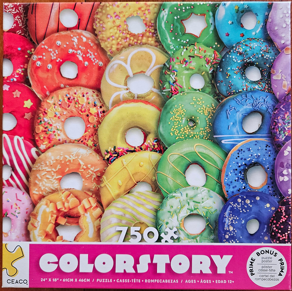A close-up collage of numerous colorful glazed donuts arranged in a dense grid.