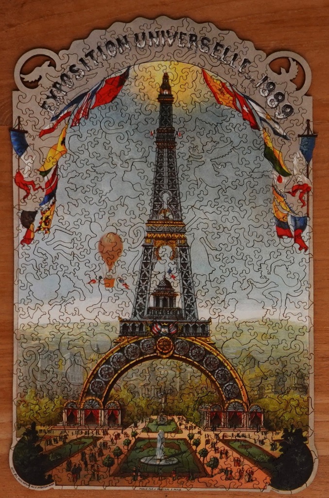 A vintage illustration of the Eiffel Tower during the 1889 Exposition Universelle in Paris.