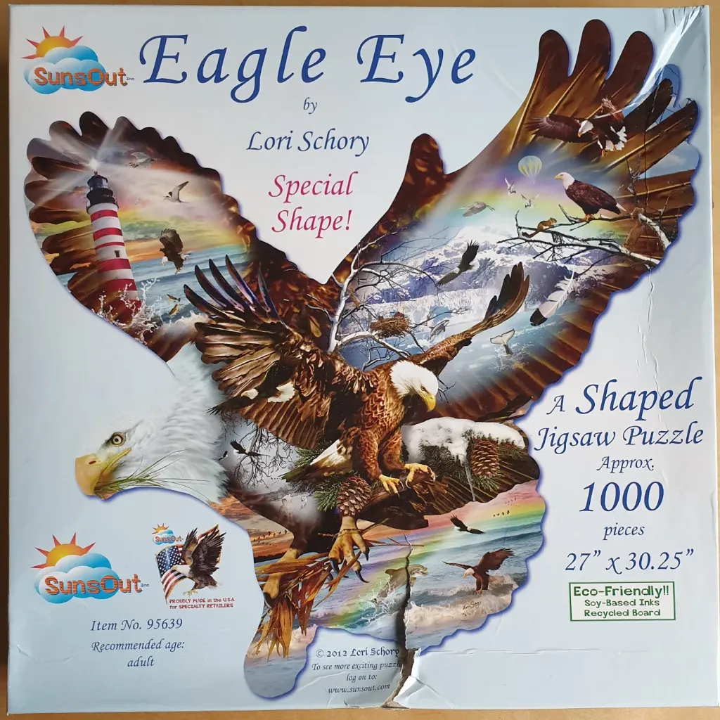 A collage artwork shaped like a large eagle featuring a lighthouse, mountain scenery, and multiple bald eagles.
