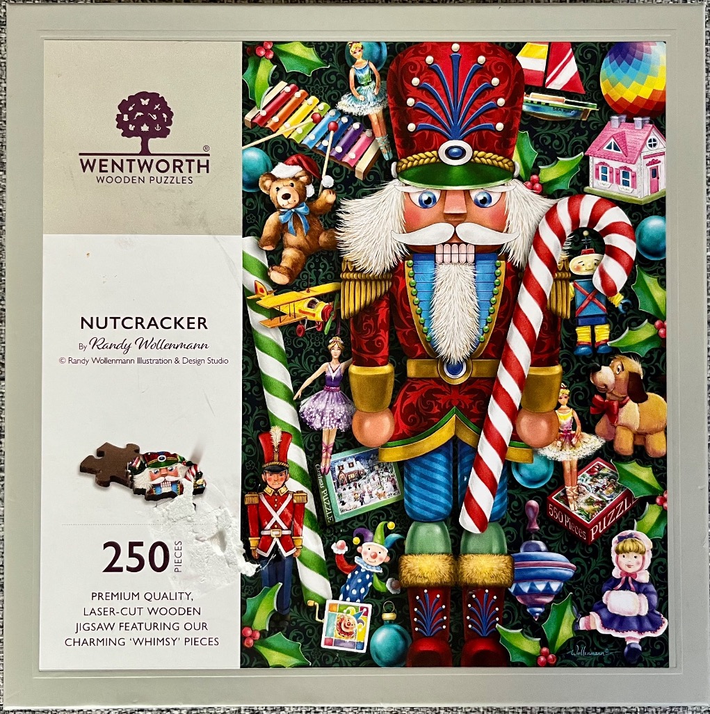 A whimsical illustration of a central toy nutcracker surrounded by various Christmas toys and holiday decorations.