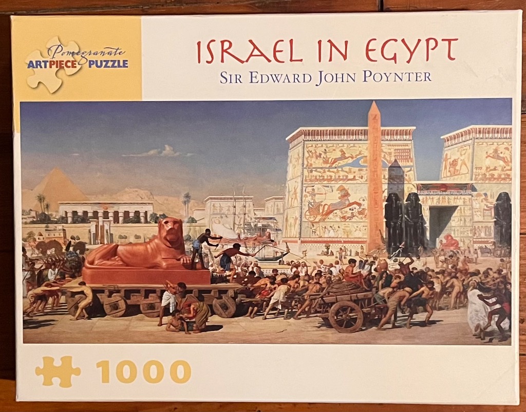 Painting titled Israel in Egypt showing ancient laborers moving a massive stone lion statue near Egyptian temples.