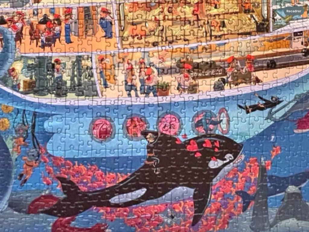 Cutaway view of a cruise ship with people on decks and an orca swimming in the ocean below.