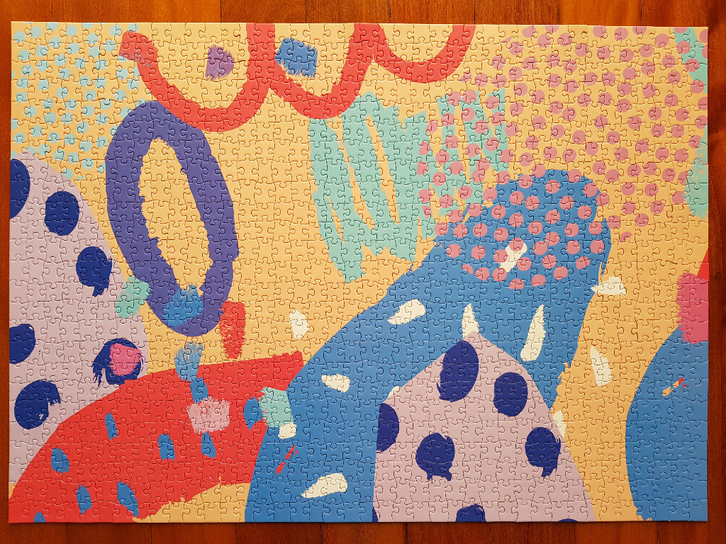 An abstract artwork featuring colourful organic shapes, polka dots, and squiggly lines on a light beige background.