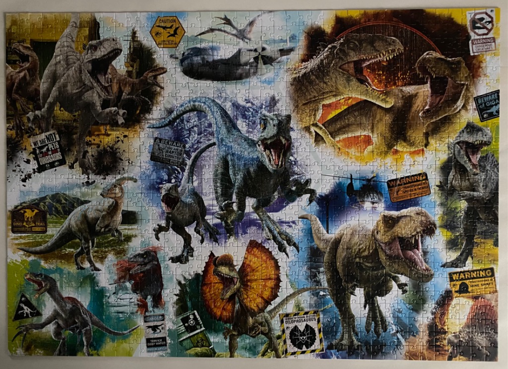 Collage of various dinosaurs from the Jurassic World franchise with warning signs and industrial motifs.