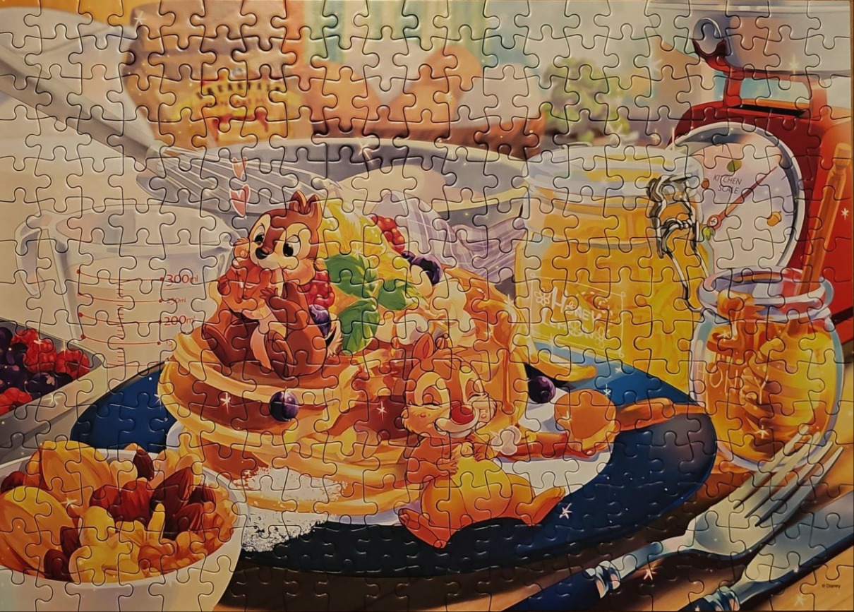 Chip and Dale enjoying a breakfast of pancakes topped with berries, honey, and nuts.