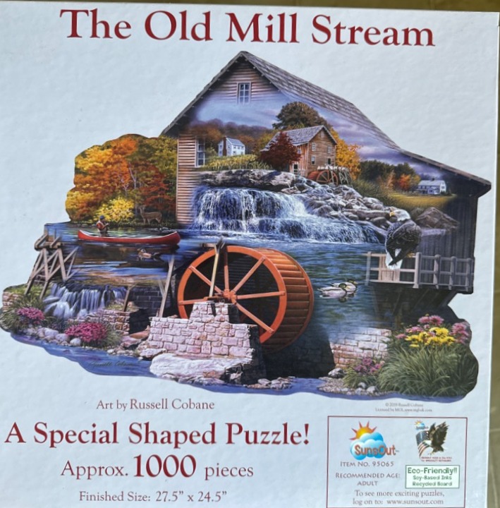 An illustration of an old water mill with a waterfall and forest, shaped like the outline of the building.