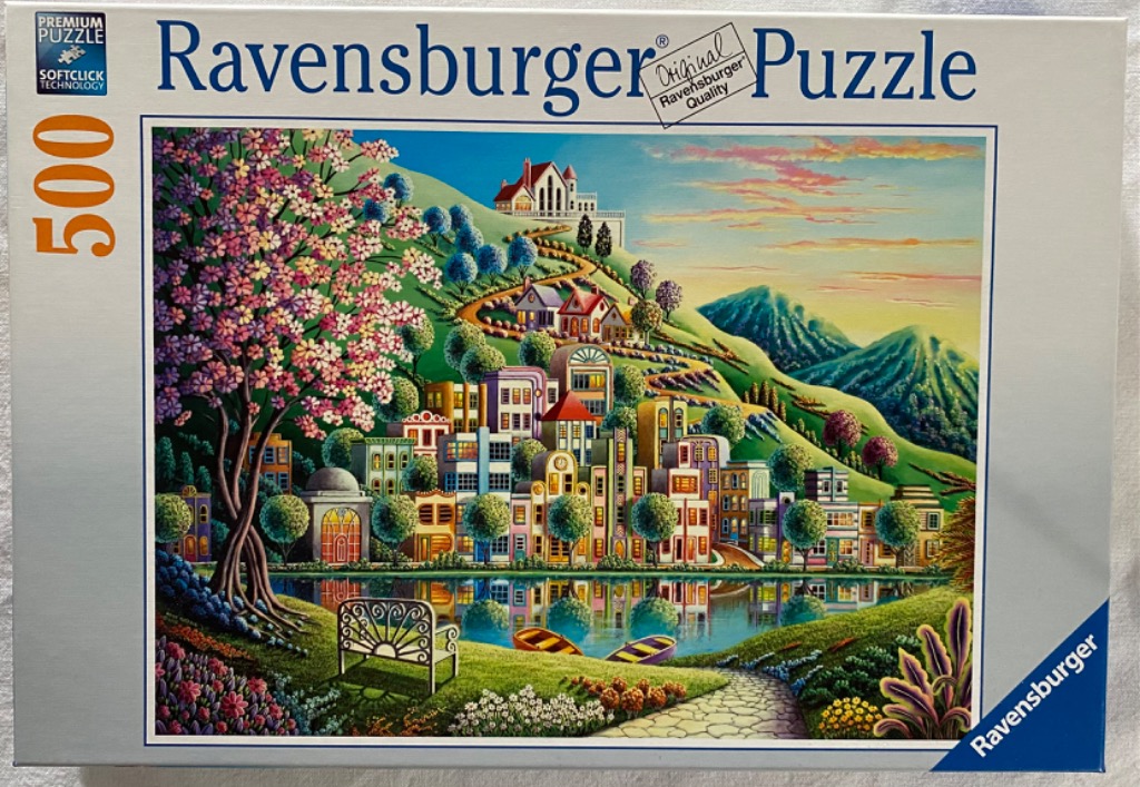 A vibrant painting of a hillside town overlooking a tranquil lake with a blooming tree in the foreground.