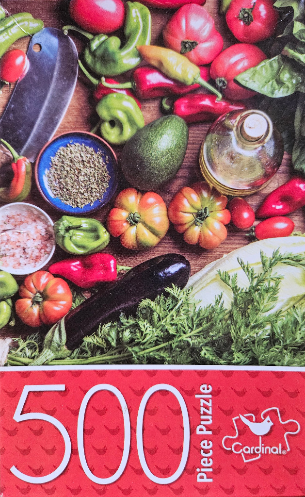 Top-down view of fresh vegetables, herbs, and cooking oil on a wooden table.
