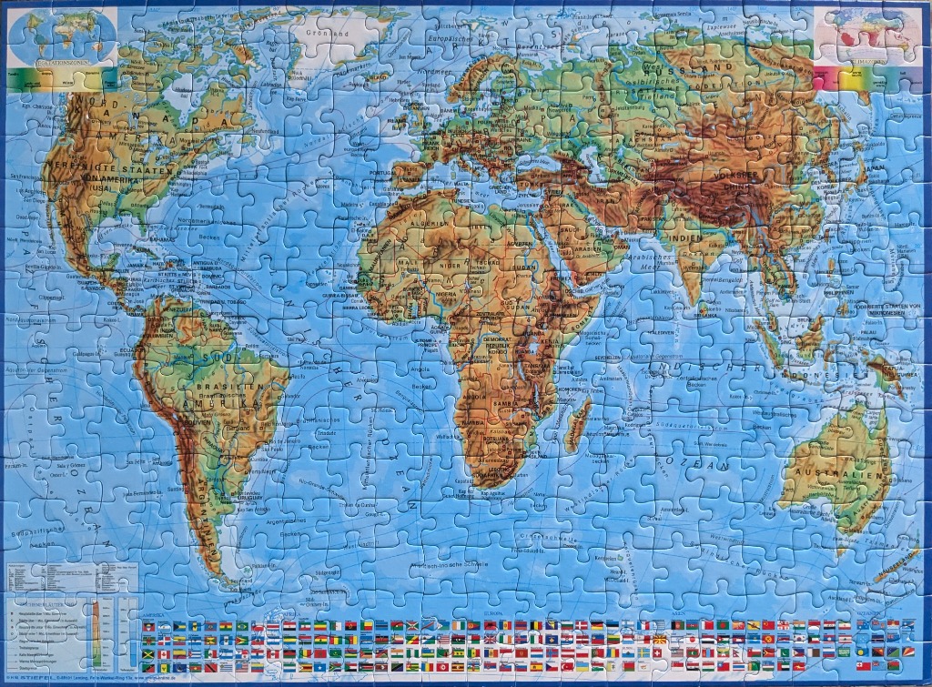 A detailed physical world map showing topography and national flags in German language.