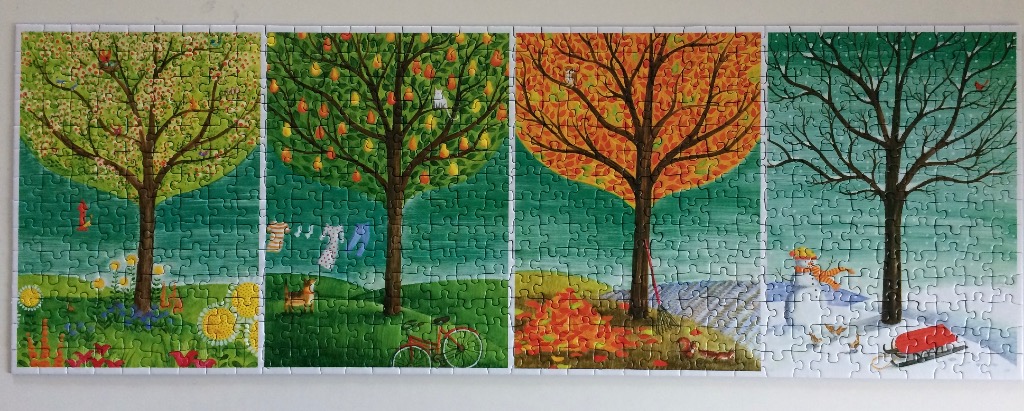 A four-panel illustration depicting a single tree undergoing the four seasons of the year from spring to winter.