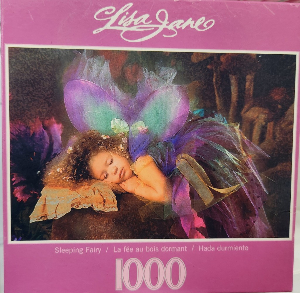 A young child with curly hair dressed as a fairy with iridescent purple wings, sleeping peacefully in a dark forest.