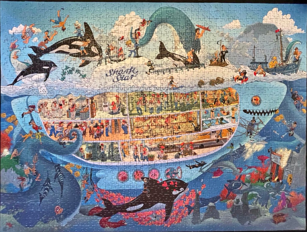 A whimsical illustration of a giant submarine shaped like a shark, bustling with activity above and below the ocean surface.