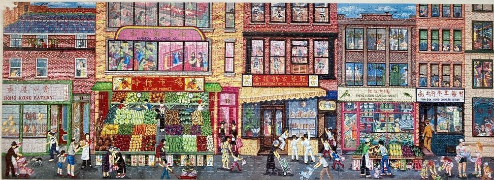 A bustling Chinatown street scene featuring storefronts, markets, and pedestrians.