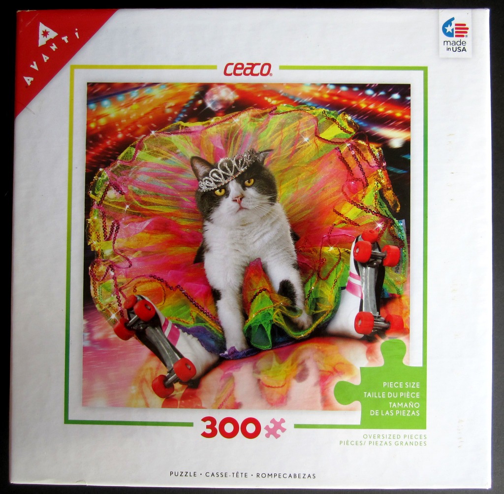 A grey and white cat wearing a tiara and a neon tulle skirt while sitting on roller skates.