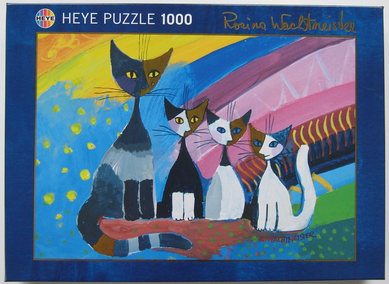 A whimsical painting of four stylized cats standing in a row against a colourful, abstract background.