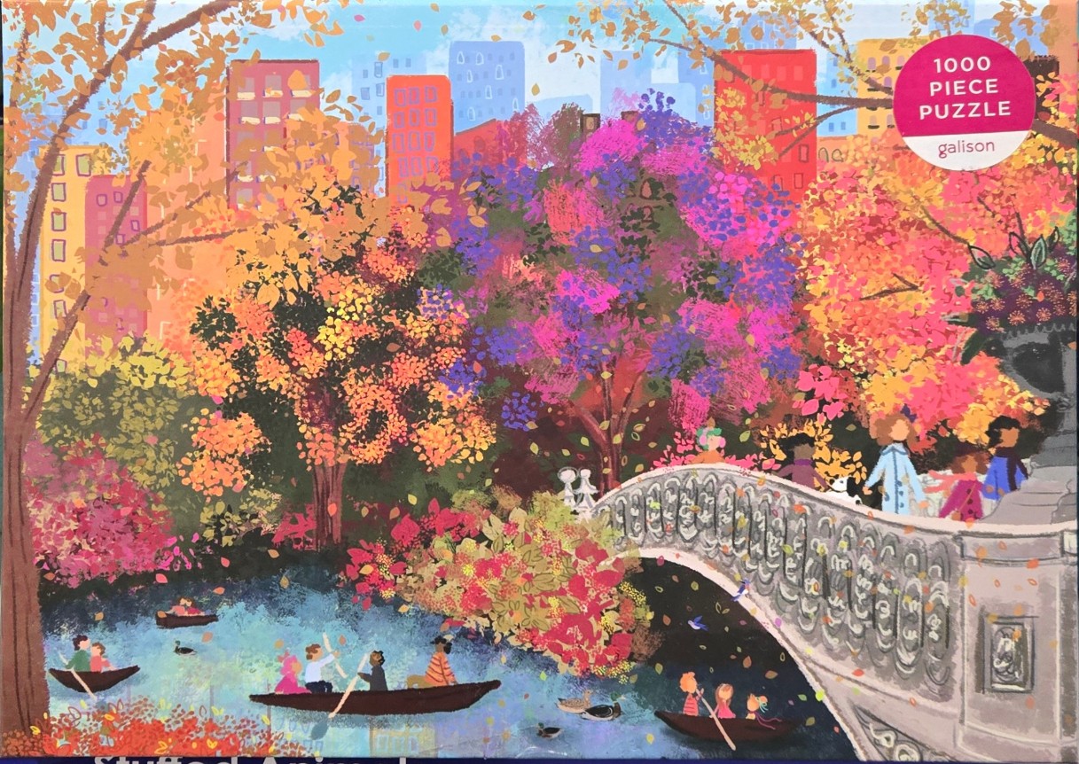 A vibrant, painterly illustration of a park in autumn featuring a stone bridge, people in rowboats, and city buildings.