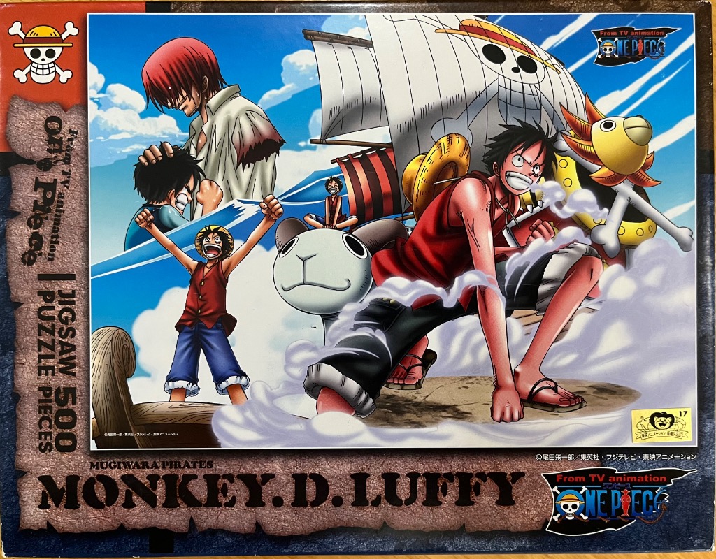 Anime illustration featuring Monkey D. Luffy and Shanks on a ship at sea under a blue sky.