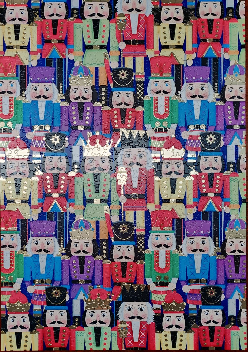 A repeating pattern of colorful, whimsical nutcracker figures