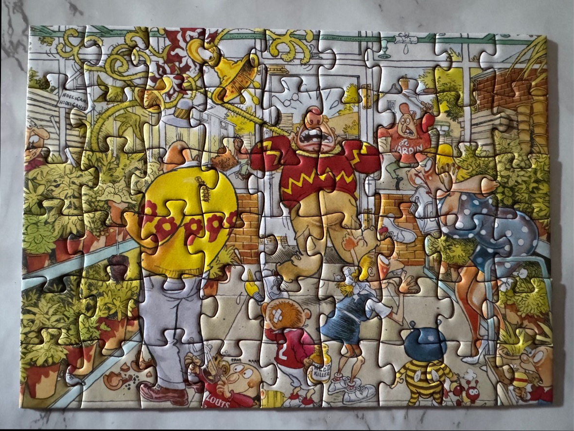 Cartoon characters in a chaotic garden setting. Yellows, greens, and reds dominate.
