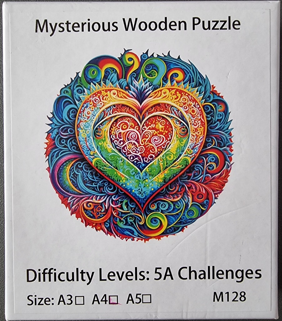 A circular, mandala-style illustration of a vibrant, multi-colored heart shape filled with intricate patterns.