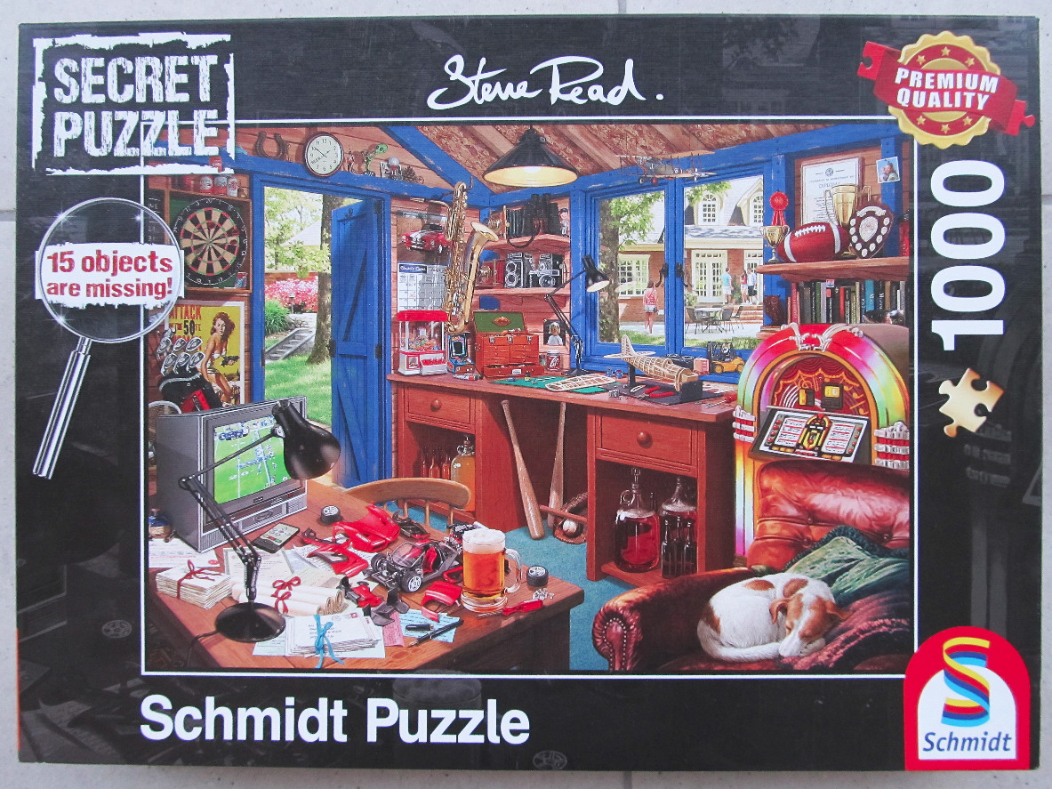 A detailed illustration of a cozy, cluttered hobby workshop with a desk, jukebox, and sleeping dog.