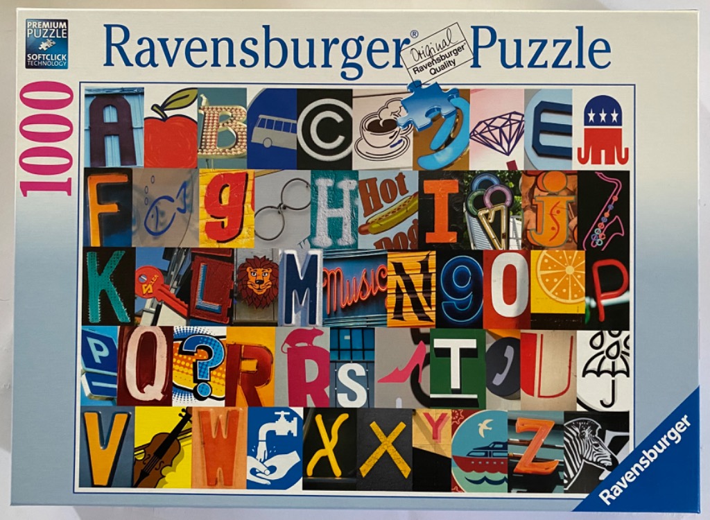 A collage of 26 photographic squares, each featuring a letter of the alphabet depicted through real-world objects.