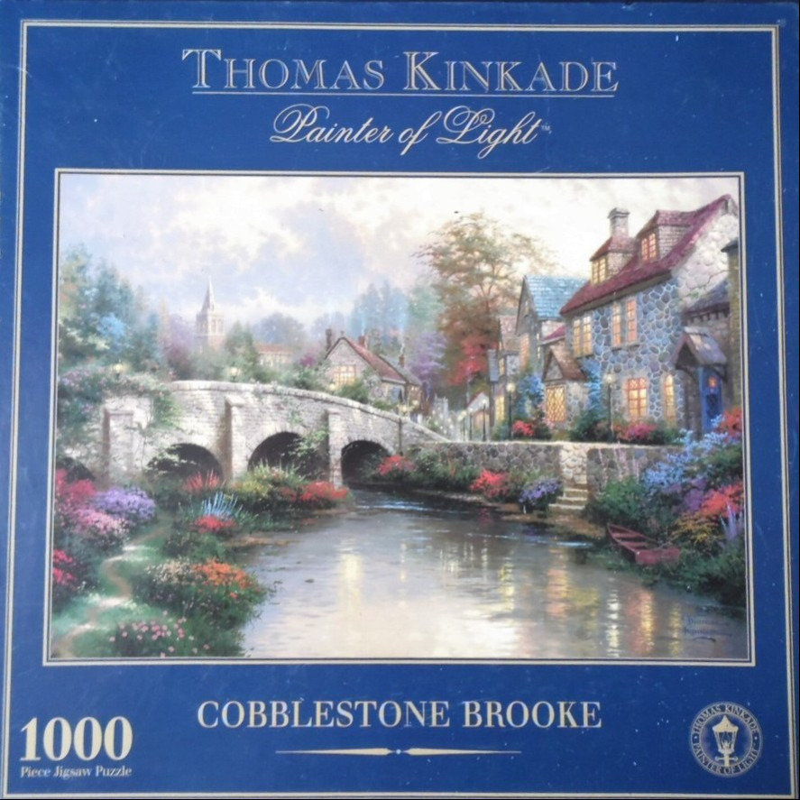 A peaceful English-style countryside scene with a stone bridge, a flowing brook, and glowing stone cottages.