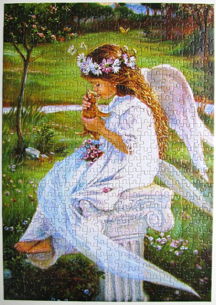 A young angel with long golden hair and a flower crown sitting on a stone pedestal while holding a small kitten.
