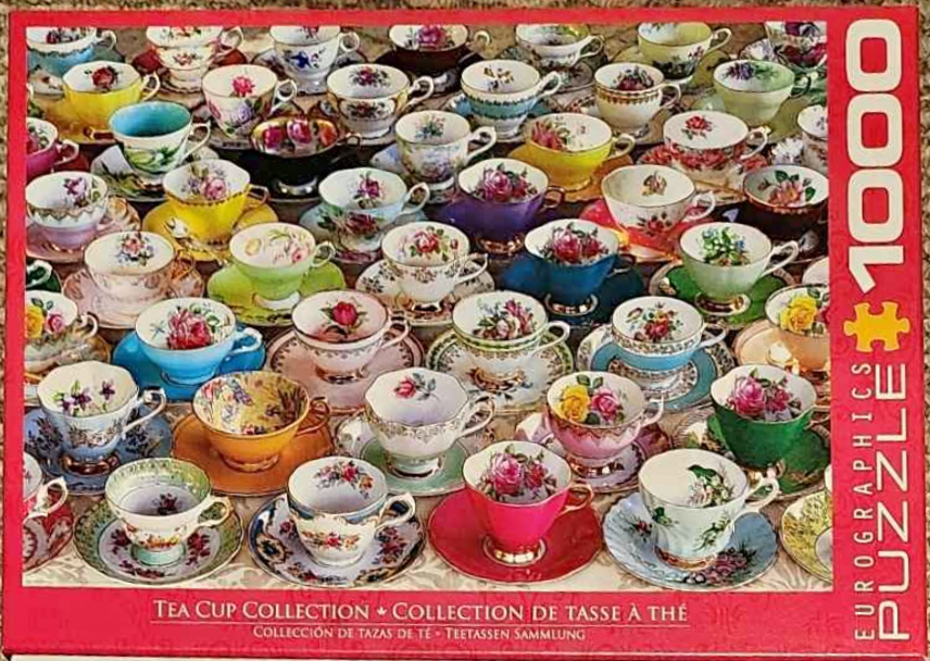 A dense grid of colorful, patterned vintage teacups with matching saucers.