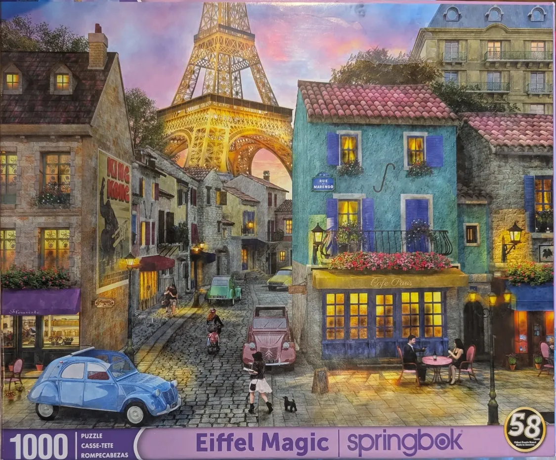 A Parisian street scene at sunset with the Eiffel Tower in the background, featuring a blue cafe, vintage cars, and people.