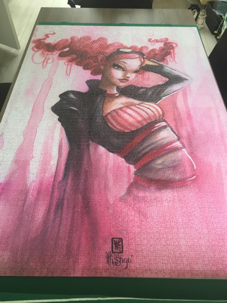 Stylized illustration of a woman with large, vibrant red hair against a soft pink watercolor background.