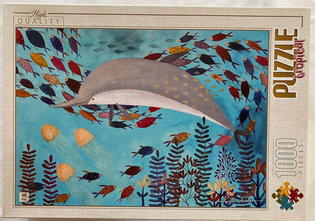 Illustration of a grey dolphin swimming through a school of colorful, patterned fish and jellyfish in blue water.
