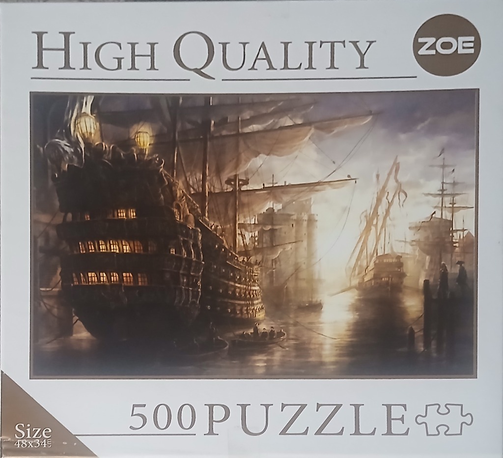 A tall, historic sailing ship anchored in a misty harbor at twilight.
