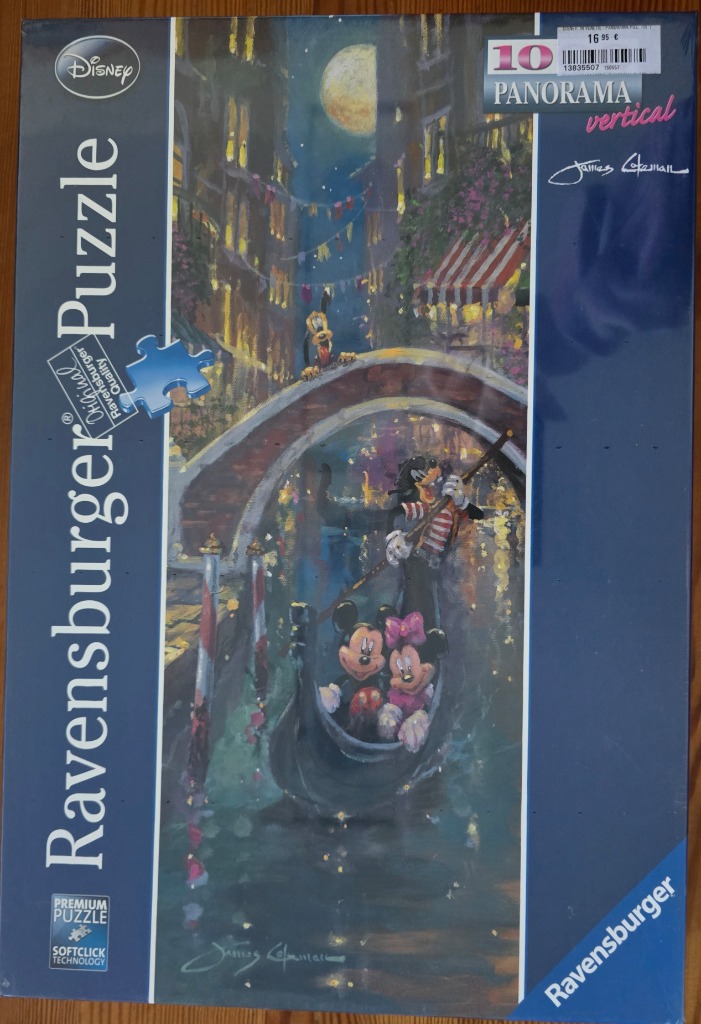 Mickey and Minnie Mouse riding in a gondola through a moonlit Venetian canal.