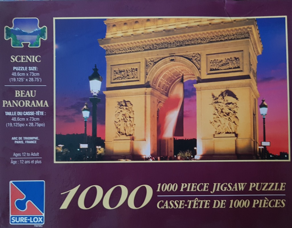 The Arc de Triomphe in Paris at twilight, illuminated against a vibrant sunset sky.
