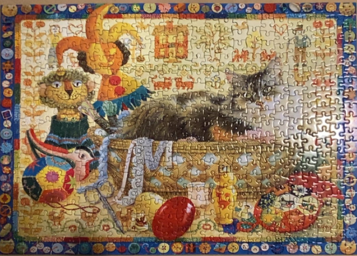 A whimsical illustration of a cat resting in a wicker basket surrounded by folk-art toys and a button-patterned border.