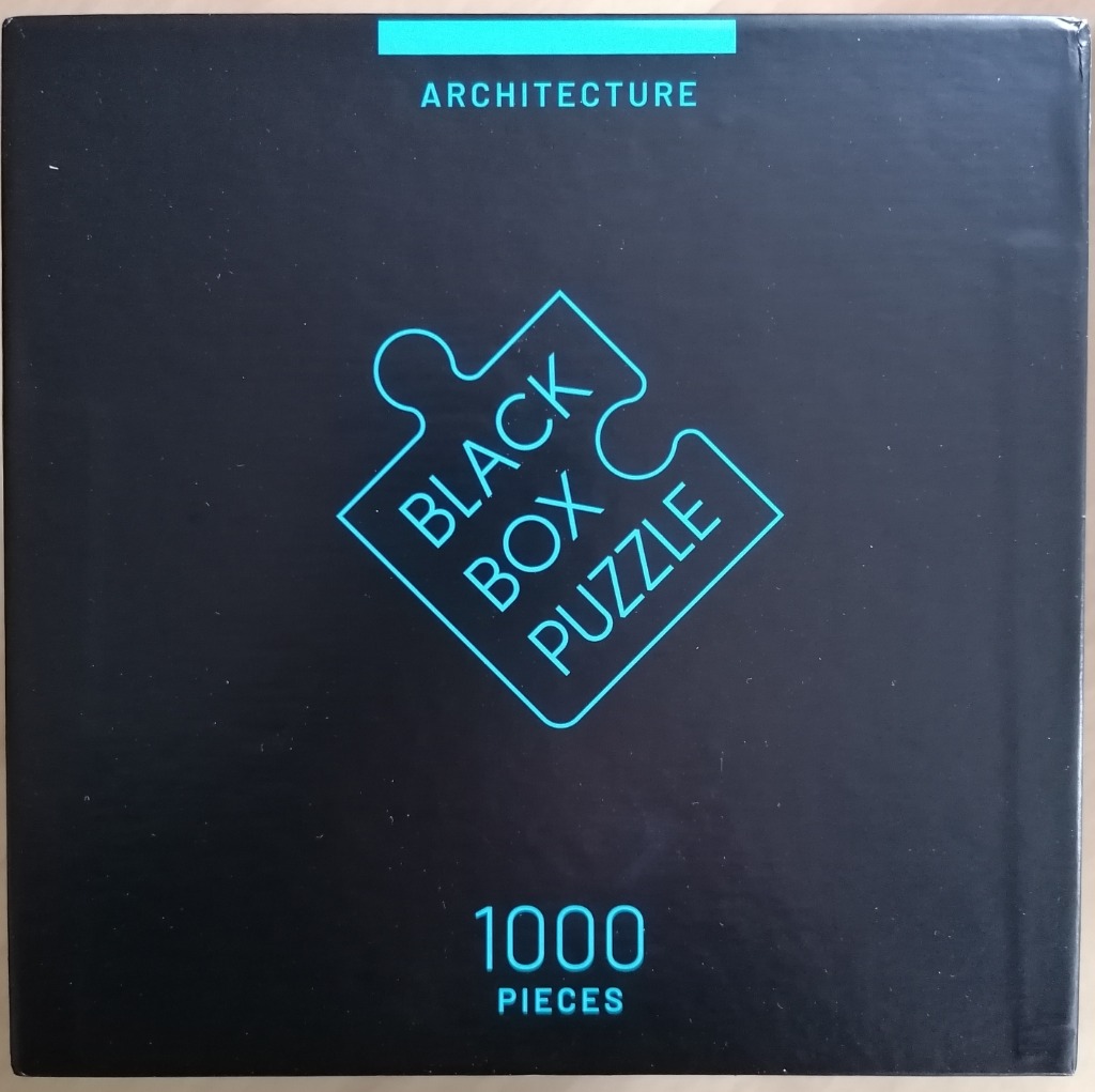 Minimalist black background with a glowing cyan puzzle piece icon and text reading Black Box Puzzle Architecture 1000 Pieces