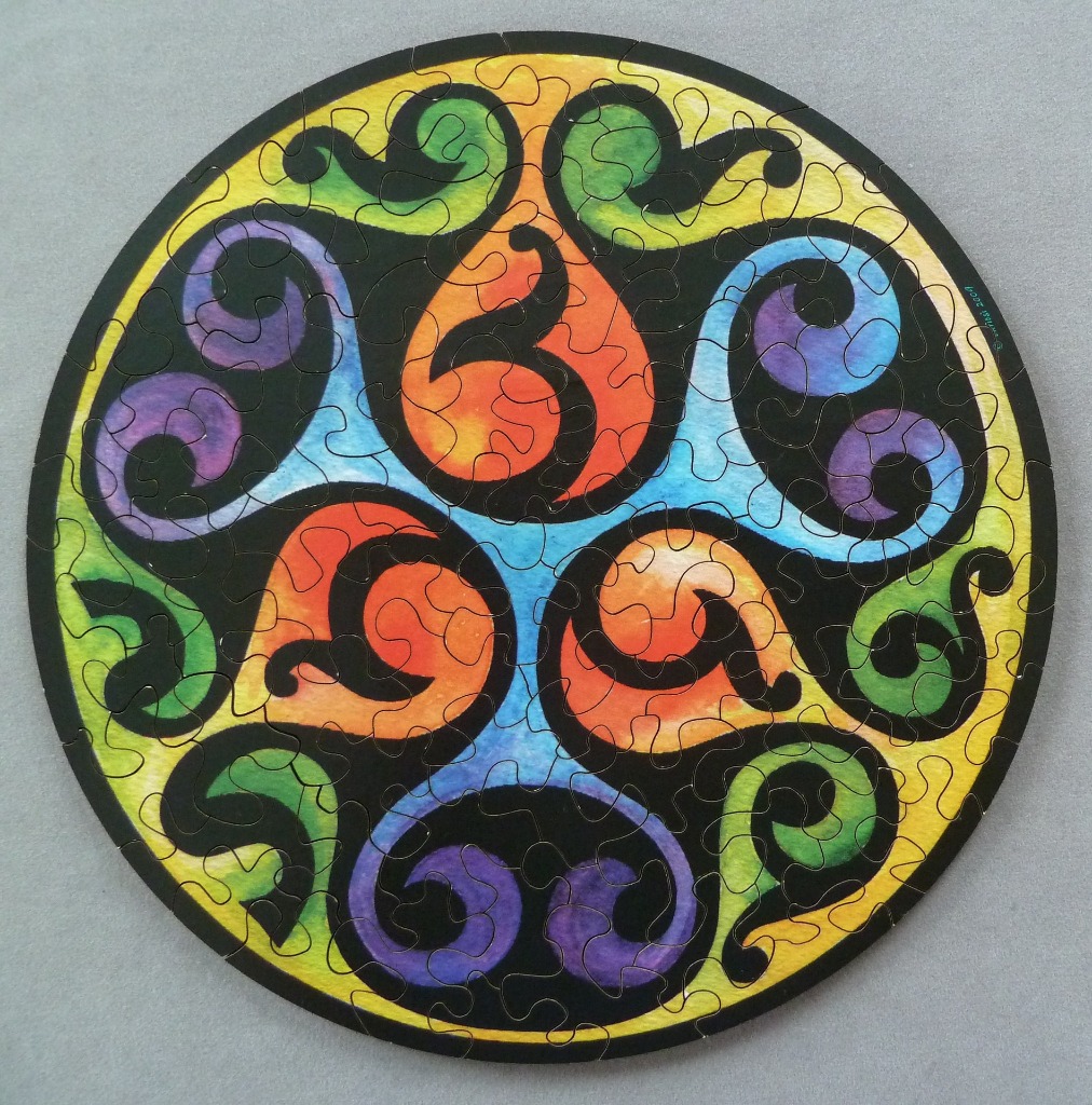 A circular illustration featuring vibrant, flowing organic shapes in a kaleidoscope style with a bold black outline.