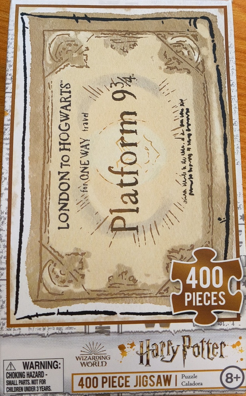 A vintage-style train ticket for Platform 9 3/4 from London to Hogwarts on a cream-coloured background.