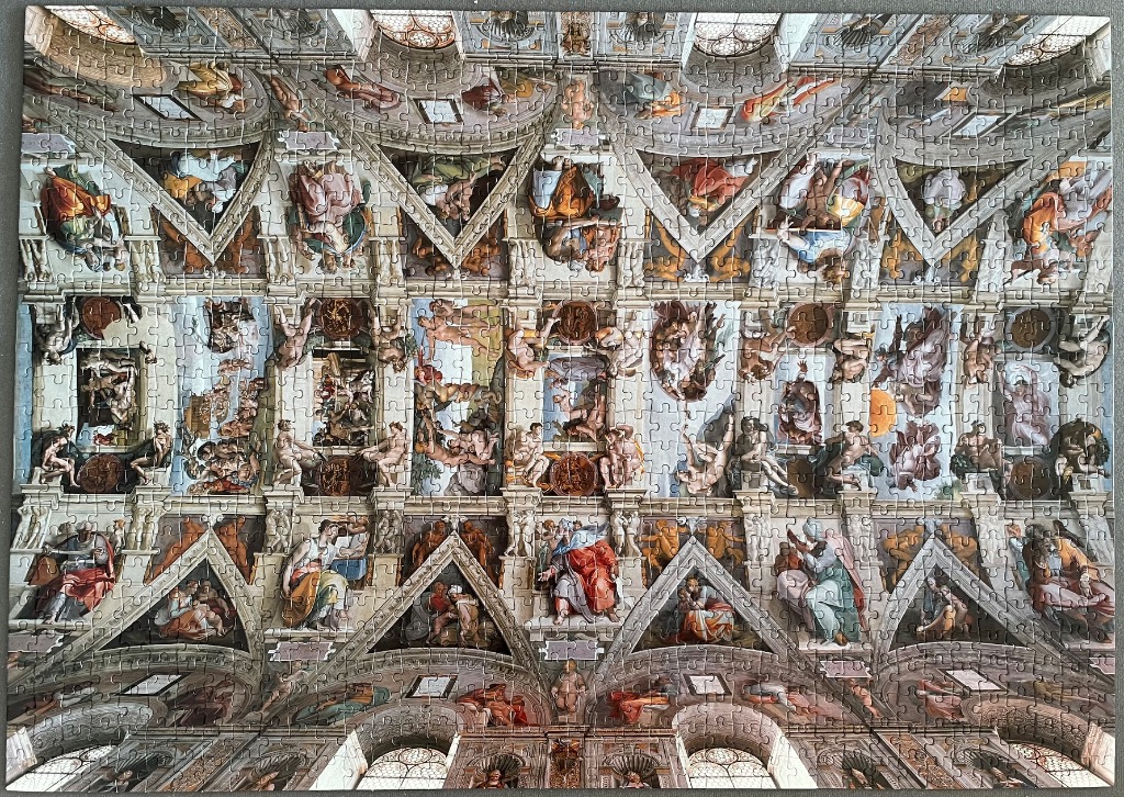 A reproduction of the Sistine Chapel ceiling featuring numerous classical religious frescoes.