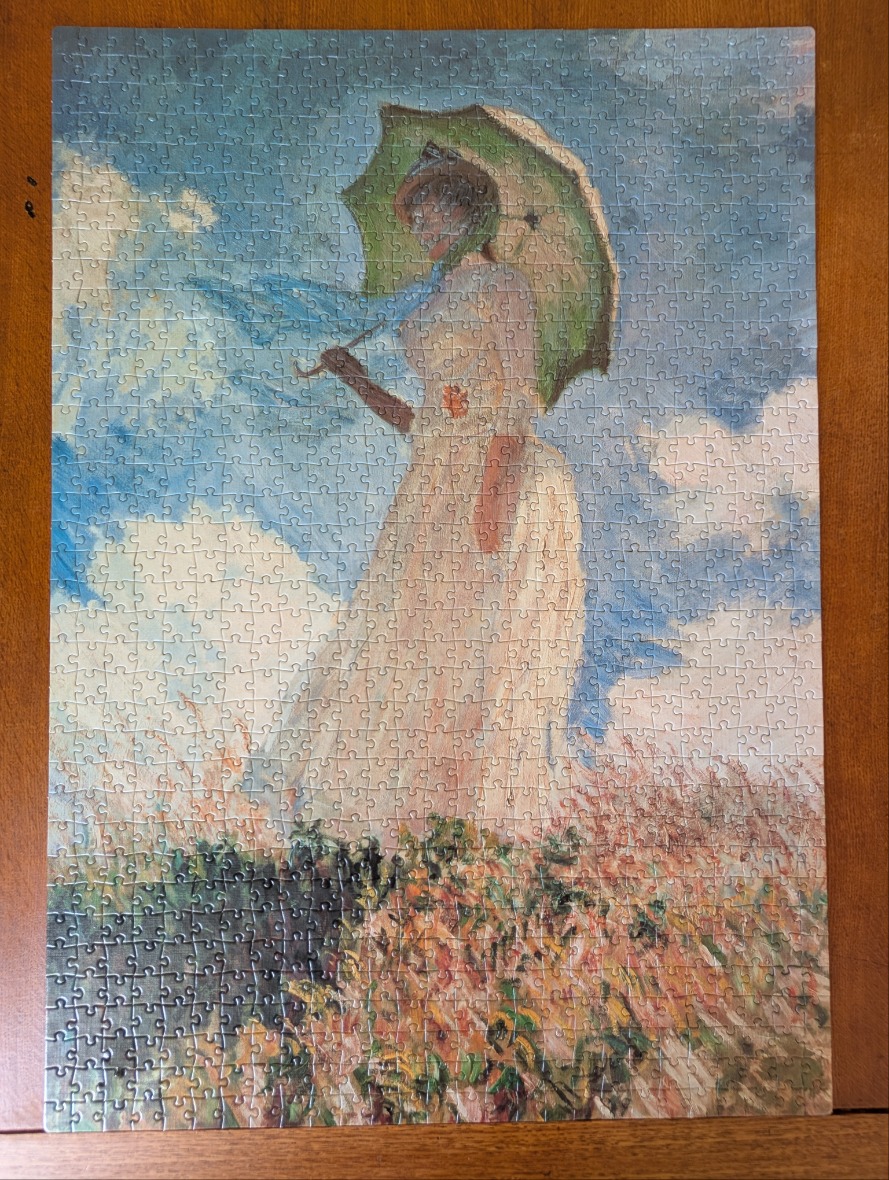 Impressionist painting of a woman in a white dress standing in a grassy meadow under a blue sky with clouds.