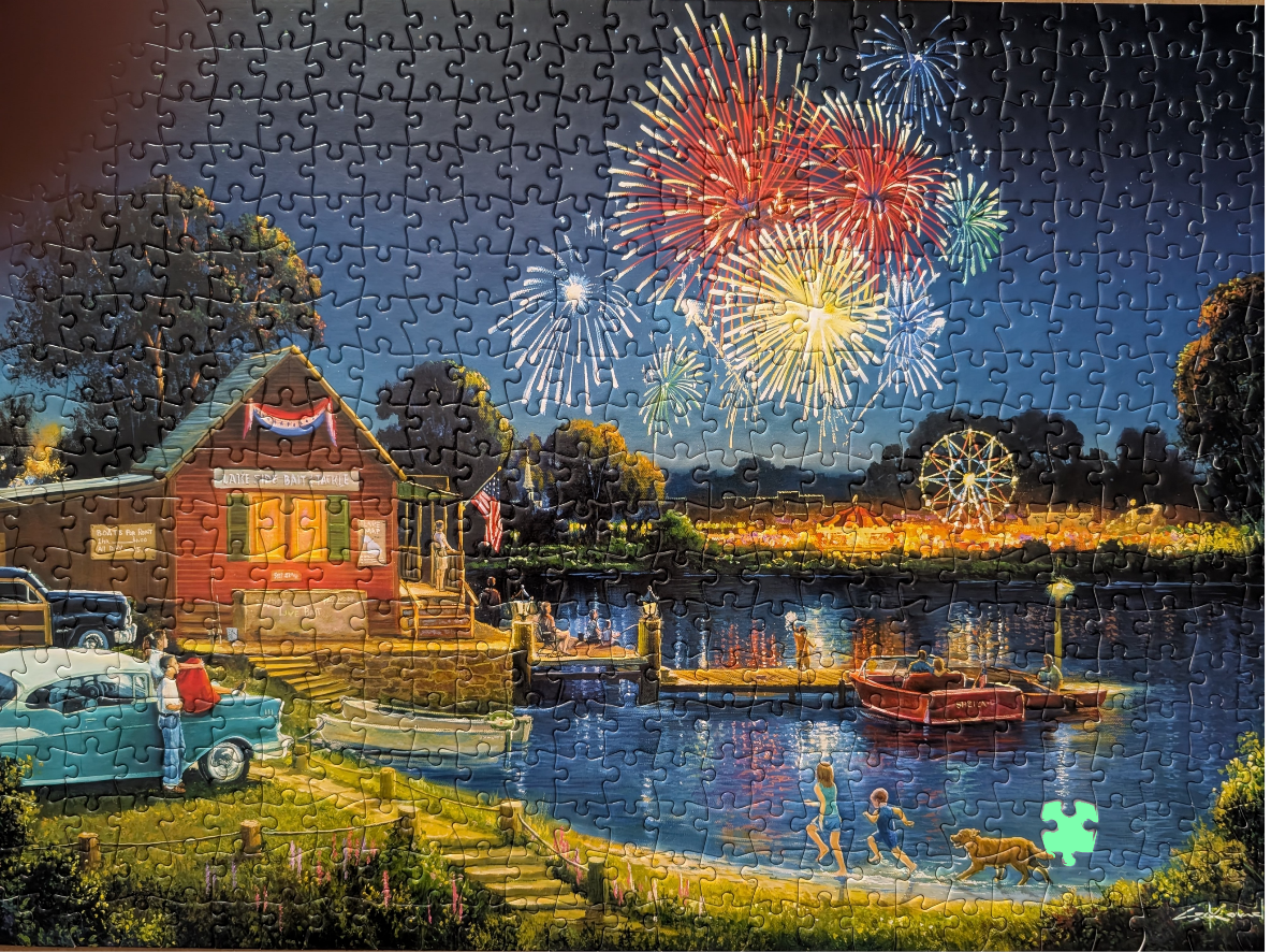 A nostalgic lakeside scene at night with fireworks, a red bait and tackle shop, and people enjoying a summer evening.