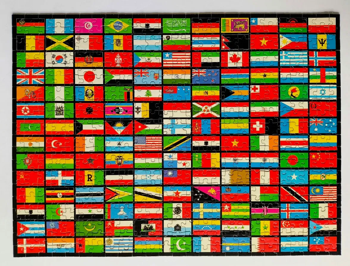 A rectangular collage of many different international flags arranged in a grid pattern.