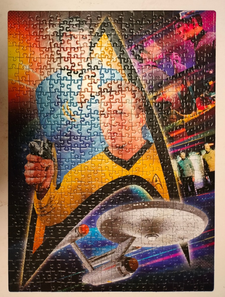 A Star Trek montage featuring Captain Kirk holding a phaser, the Enterprise, and various crew members.