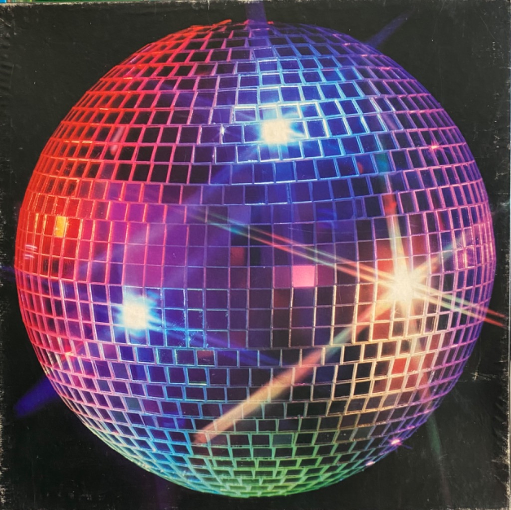 A reflective disco ball shimmering with colorful lights against a dark background.