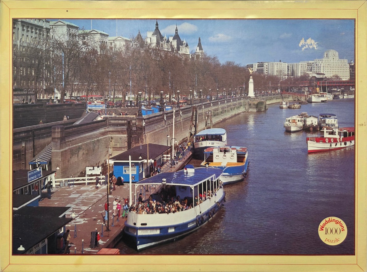 A view of the River Thames at Westminster Pier in London with the Ferry Queen boat docked.