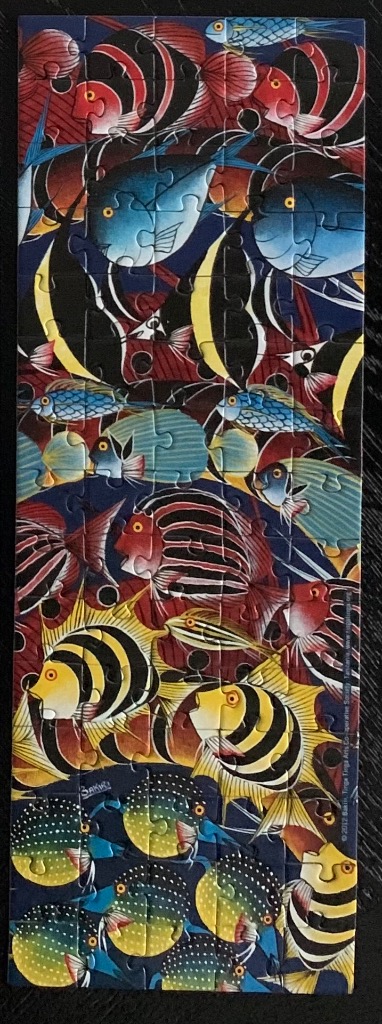 A vibrant Tinga Tinga style artwork featuring a dense vertical composition of stylized tropical fish.